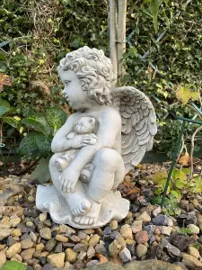 Stone Cast Cherub Ornament with Teddy on Hand