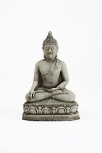 Small Meditating Buddha statue on plinth