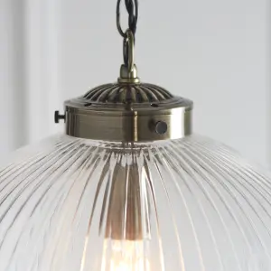 Anson Lighting Boston Pendant light finished in Antique brass plate and clear ribbed glass