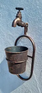 Garden Market Place Metal Wall Single Plant Holder With Ornate Tap Feature With an Antique Copper Finish