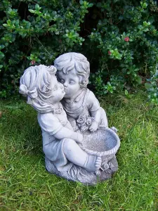 Charming Kissing Children with Flowerpot