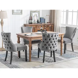 Set of 4 Velvet Upholstered Dining Chairs with Rotatable Adjustment Buttons and Nail Head Trim.